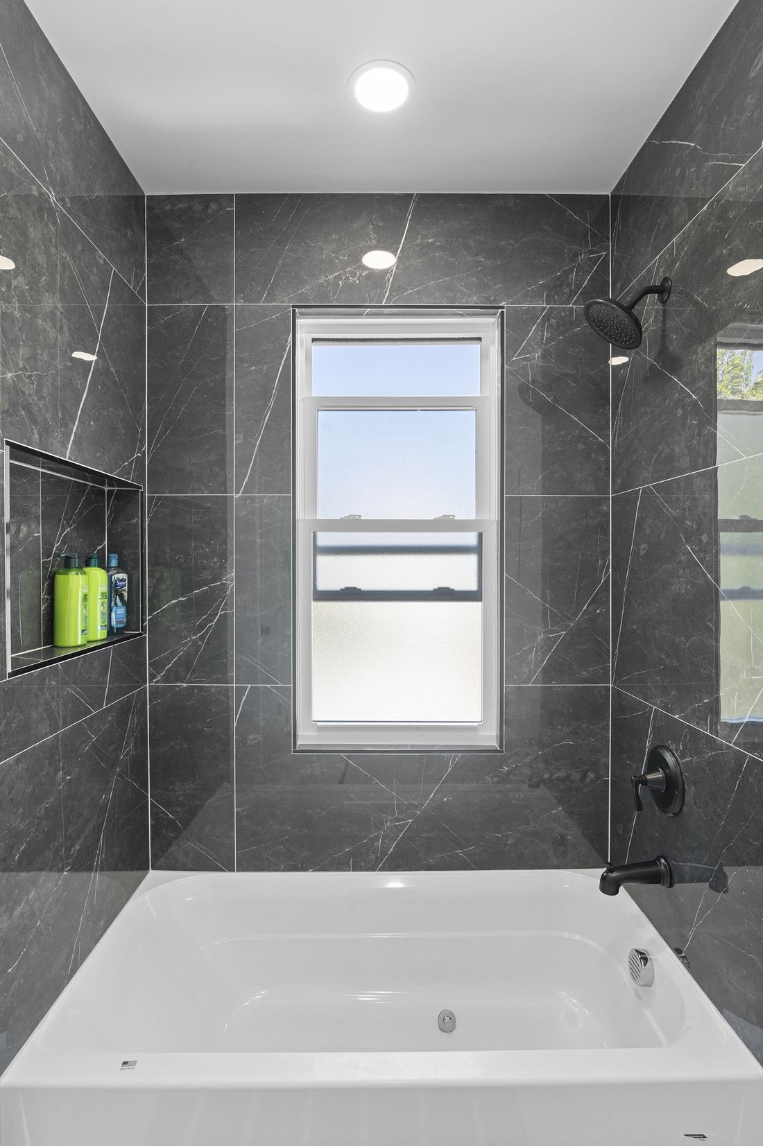 Tiled bathroom with a glass shower