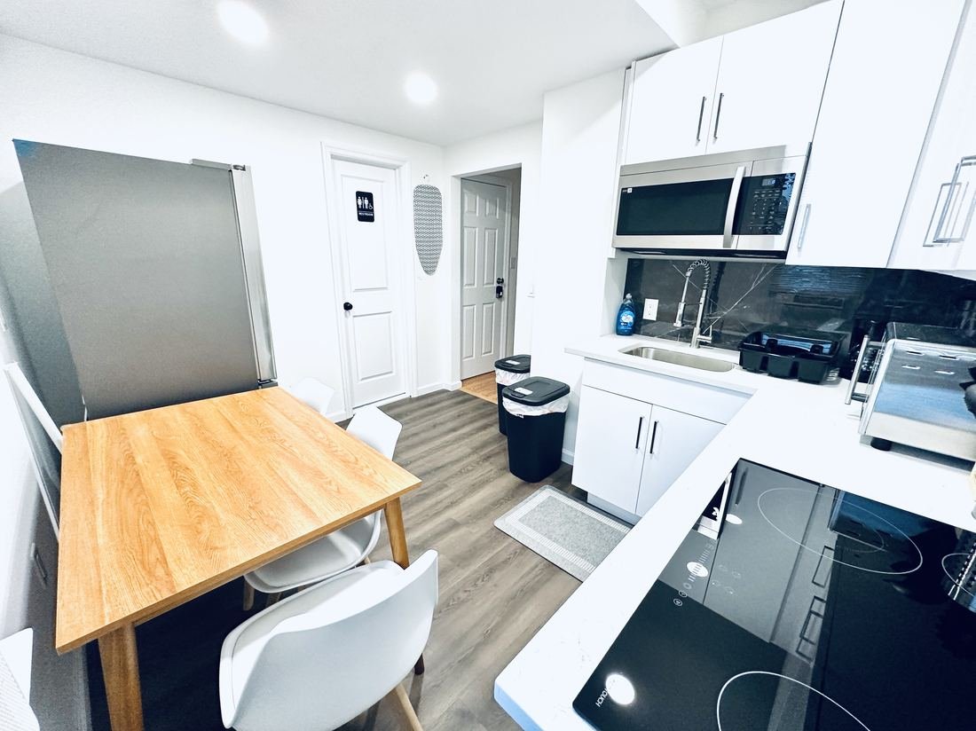 Kitchen and dining area with a butcher-block table